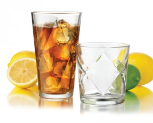 Glass of tea with lemon and lime wedges