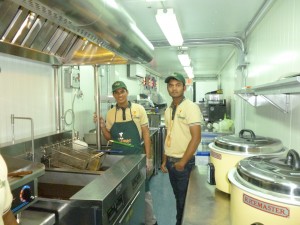 Afghan Village 3 Afghan Village Cuisine employees inspect equipment provided by KaTom Restaurant Supply.