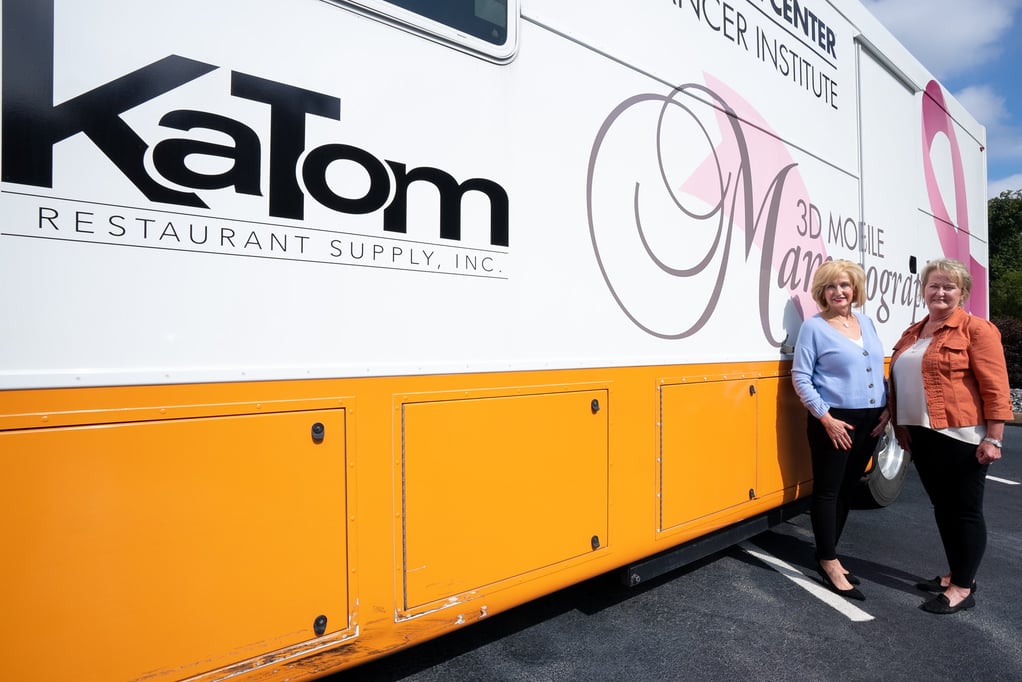 Patricia Bible & Birdie Eslinger Stand in Front of UT's Mobile Mammogram Bus