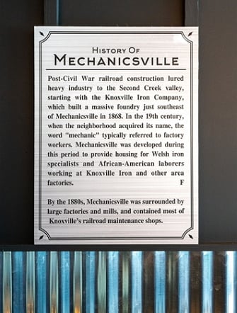 Engraved metal sign at Soul Good tells Mechanicsville history
