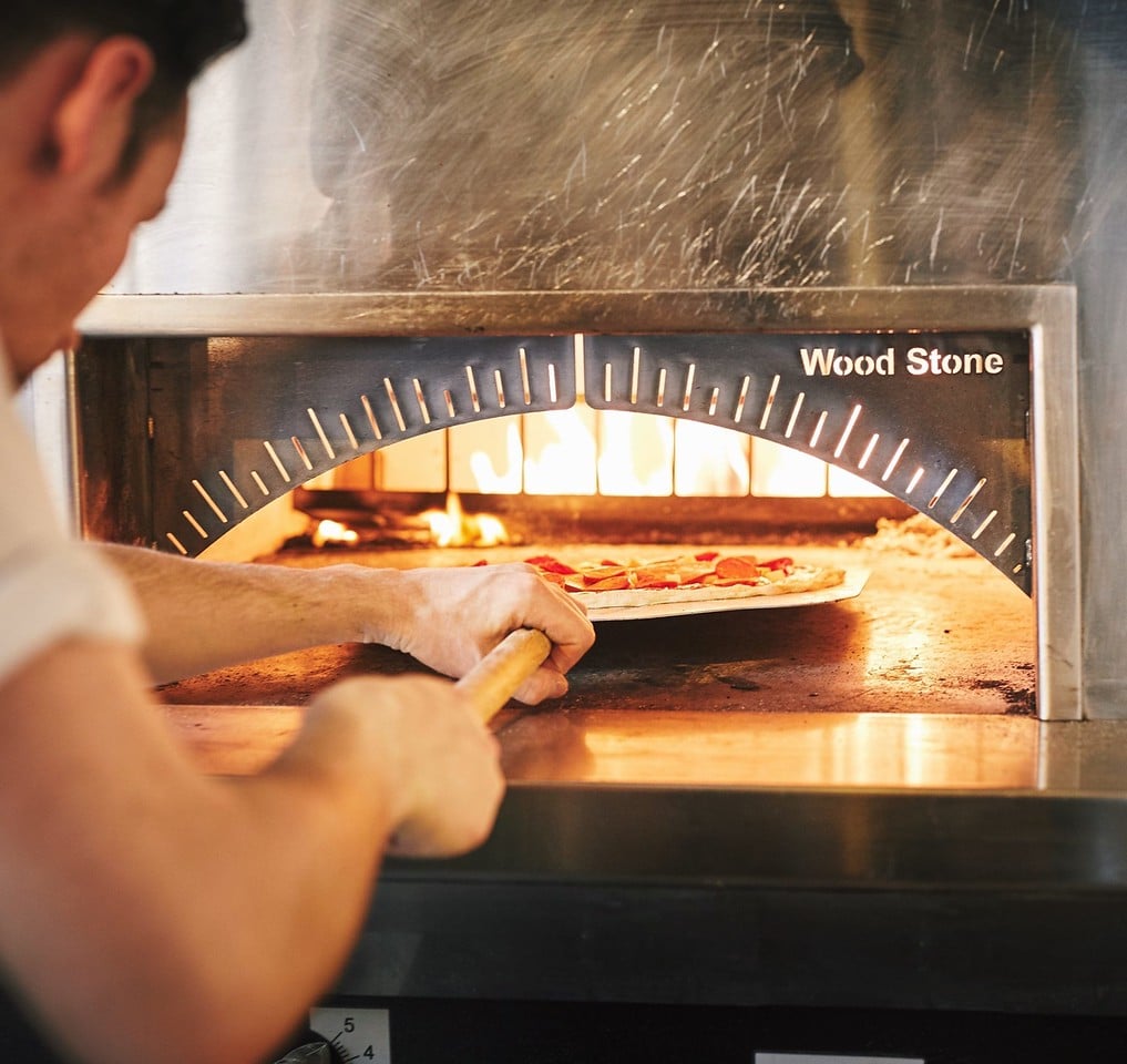An Image of a Wood Stone Oven in Use