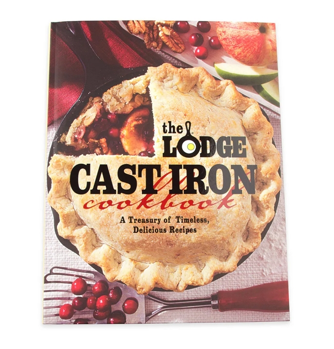 Image: A book featuring the text The Lodge Cast Iron Cookbook over an image of a fruit pie