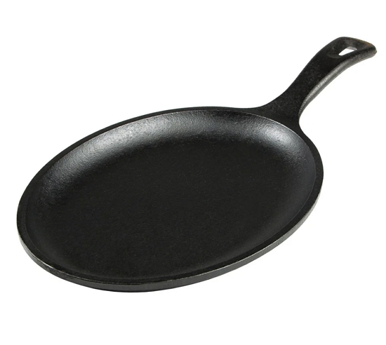 Image: A Lodge cast iron fajita platter with handle is displayed against a white background